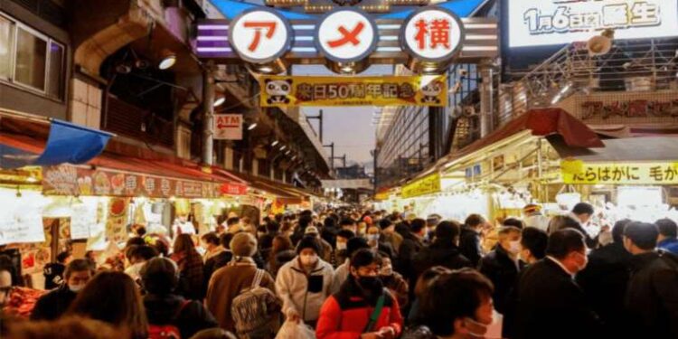 Japan's population falls while foreign residents rise to record
